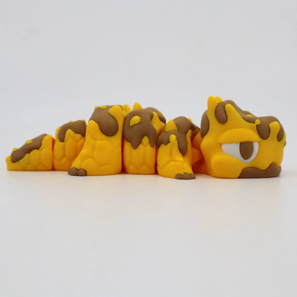 Yellow and brown 3D printed sensory fidget caterpillar toy with segmented body