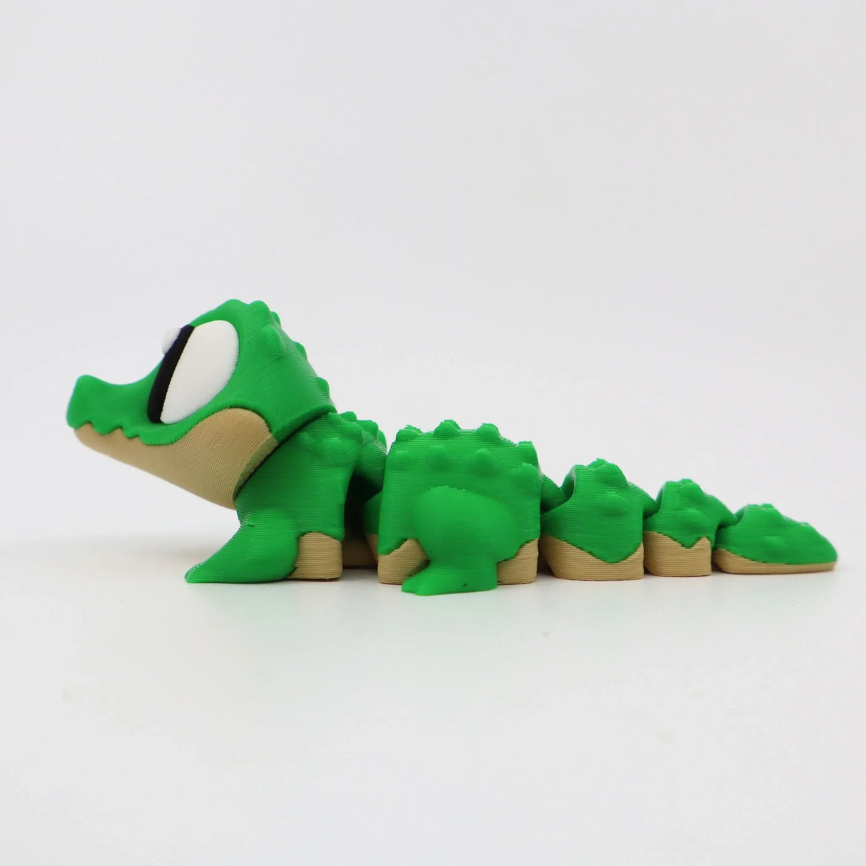 Green 3D printed flexi alligator fidget toy for sensory play and tactile stimulation