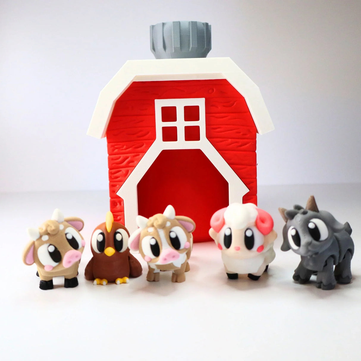 Colorful 3D printed barn toy with cute farm animal figures for sensory play
