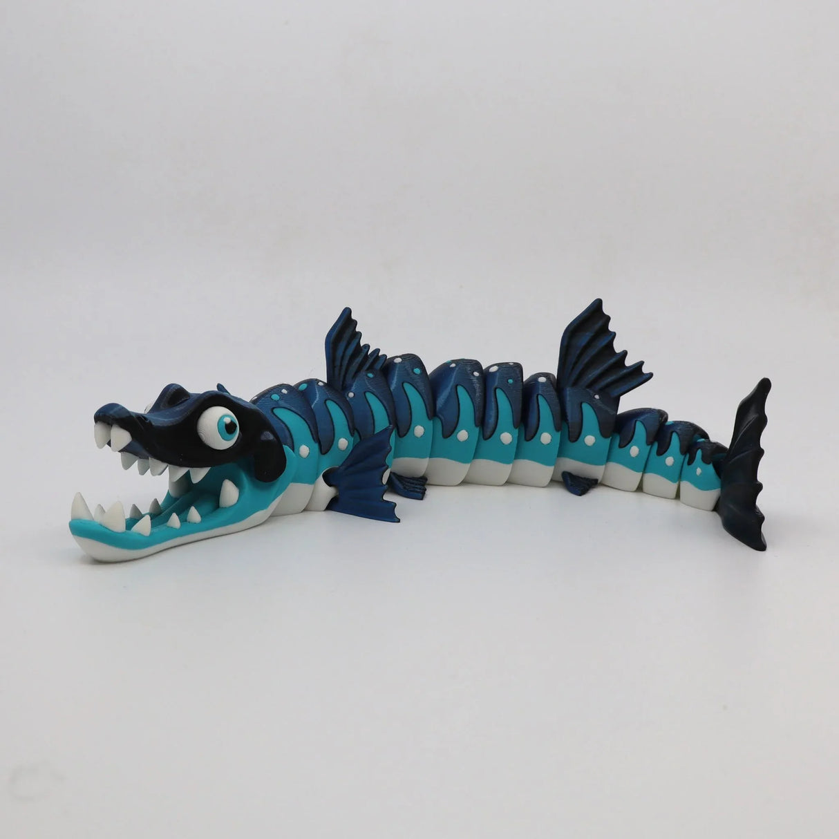 Colorful 3D printed barracuda flexi sensory toy with movable segmented body