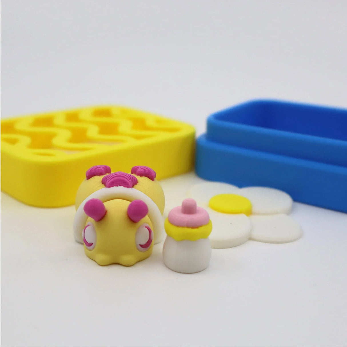 Colorful 3D printed sensory toy caterpillar with puzzle tray and stacking discs for kids