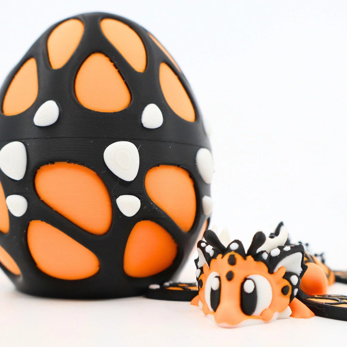 3D printed sensory butterfly toy and matching orange and black egg shell, educational fidget