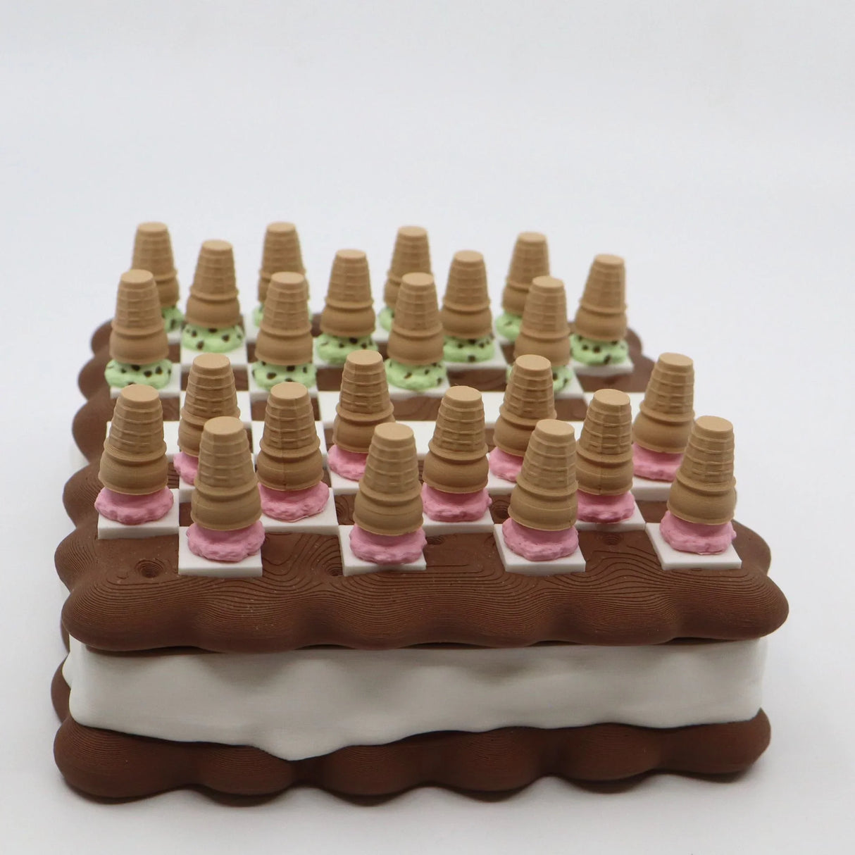 3D printed sensory checkers set with ice cream cone pieces on an ice cream sandwich board.