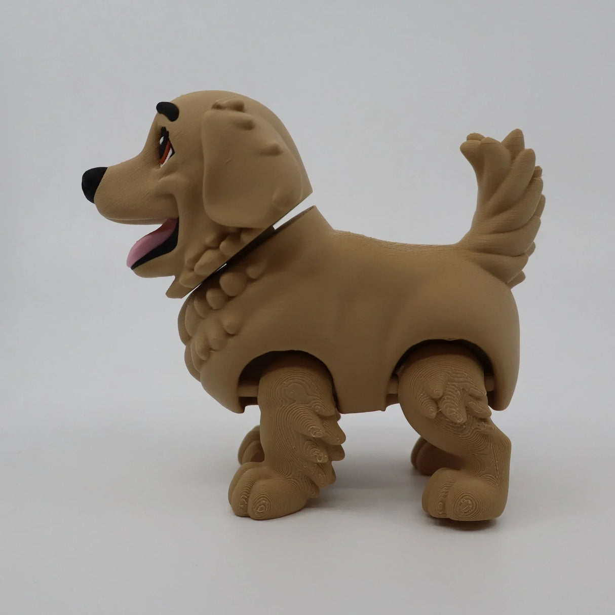 3D printed golden retriever fidget toy for sensory play, featuring textured fur and flexible joints