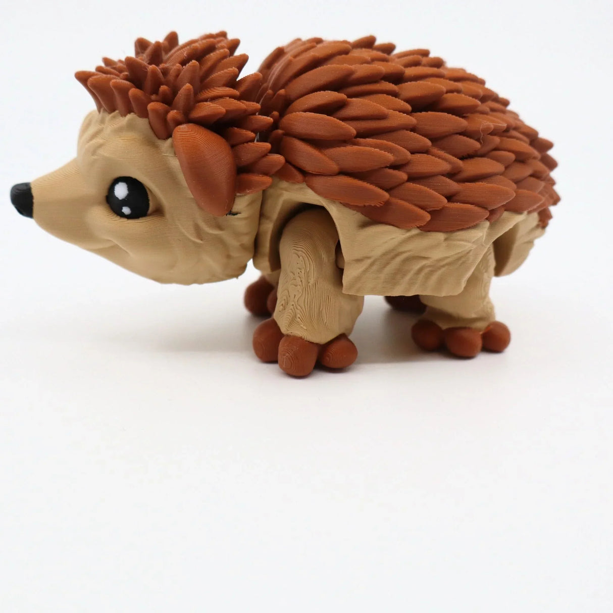 3D printed sensory toy hedgehog with brown spikes on white background