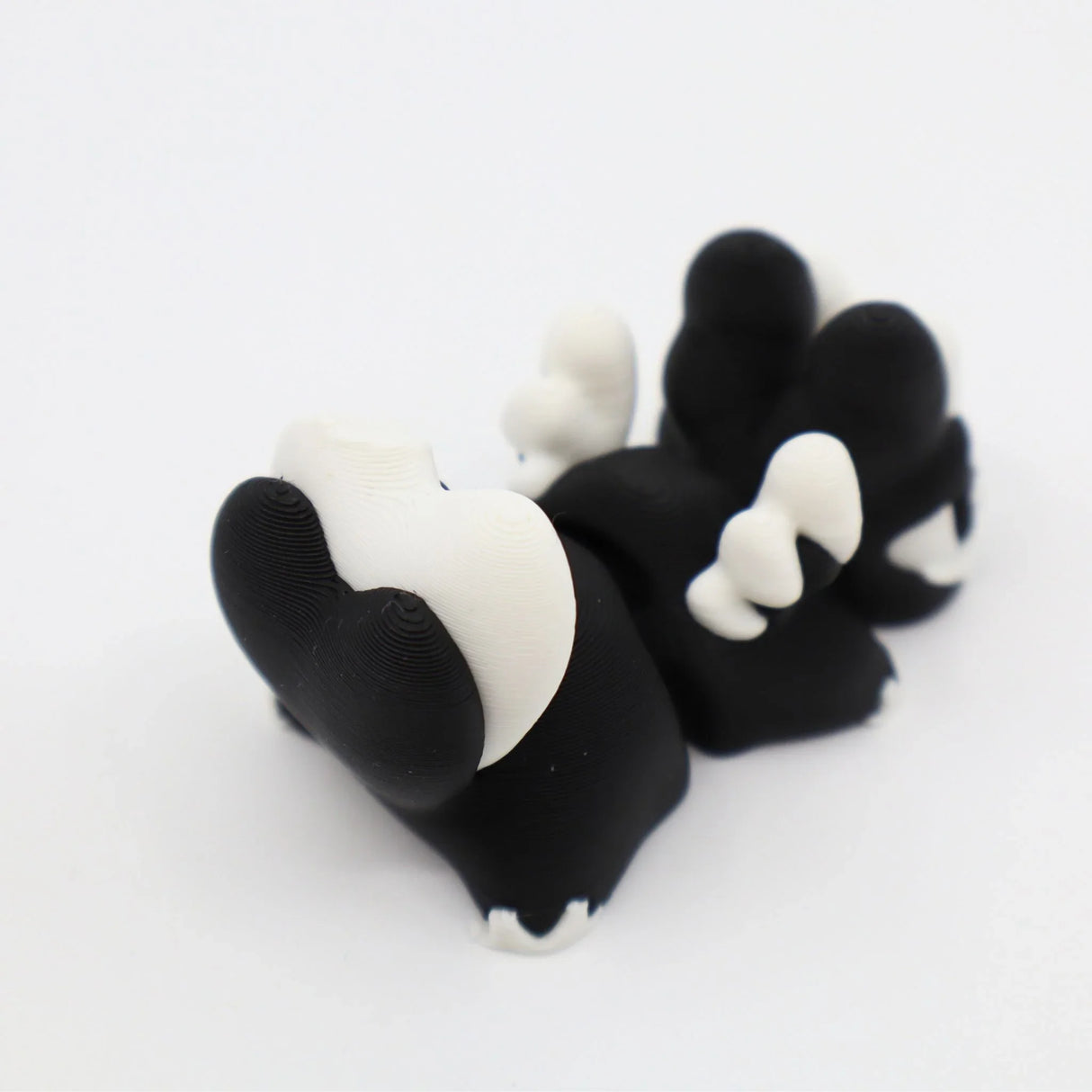 Black and white 3D printed fidget toy with textured sensory bumps for tactile play