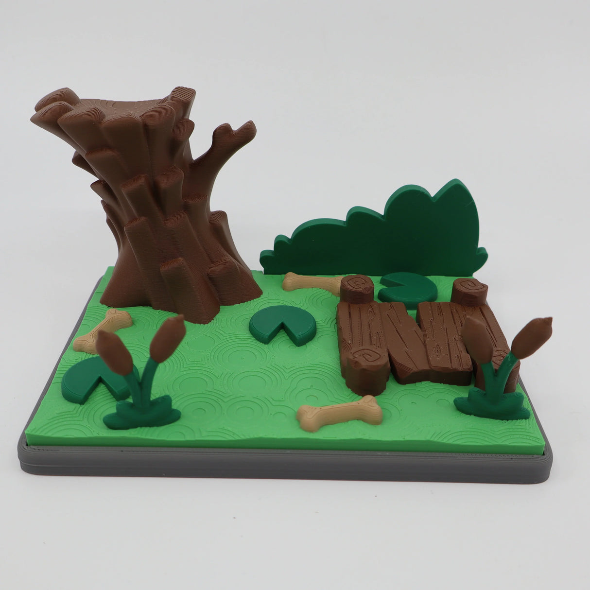 3D printed sensory toy with tree, logs, and bones for tactile play and learning