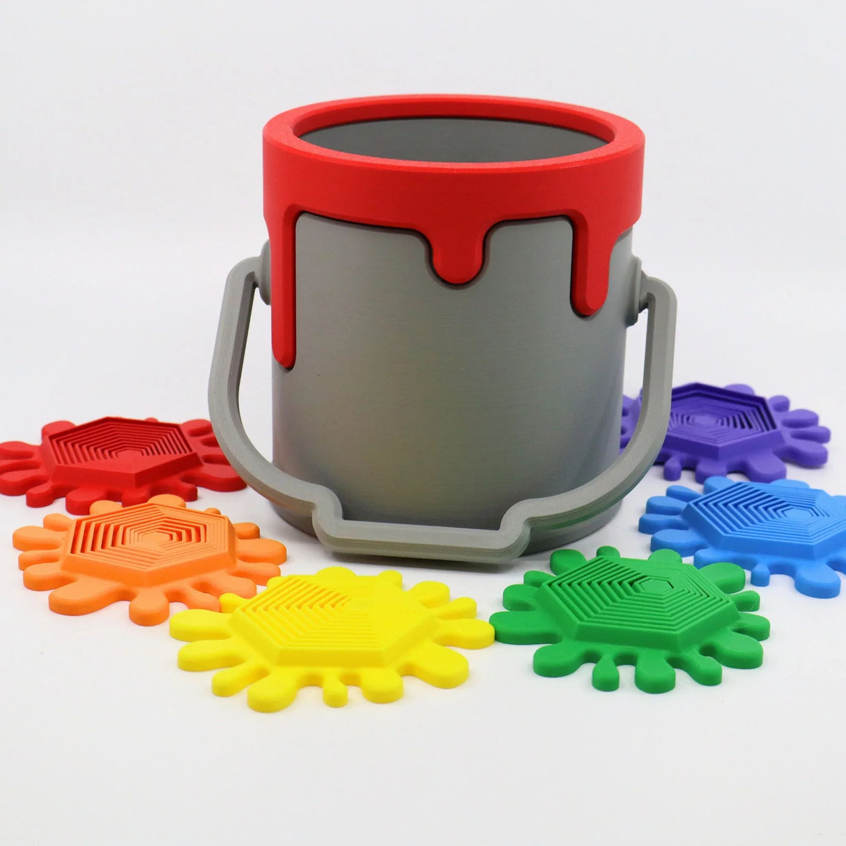 3D printed sensory paint can toy with colorful textured splat pieces arranged around it