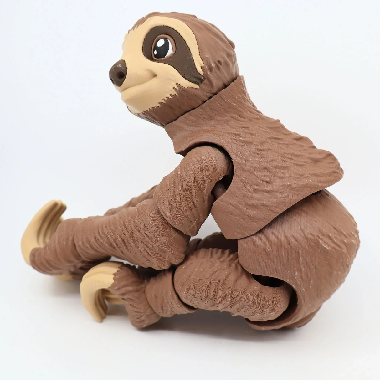 3D printed brown sloth sensory toy with jointed limbs on a white background