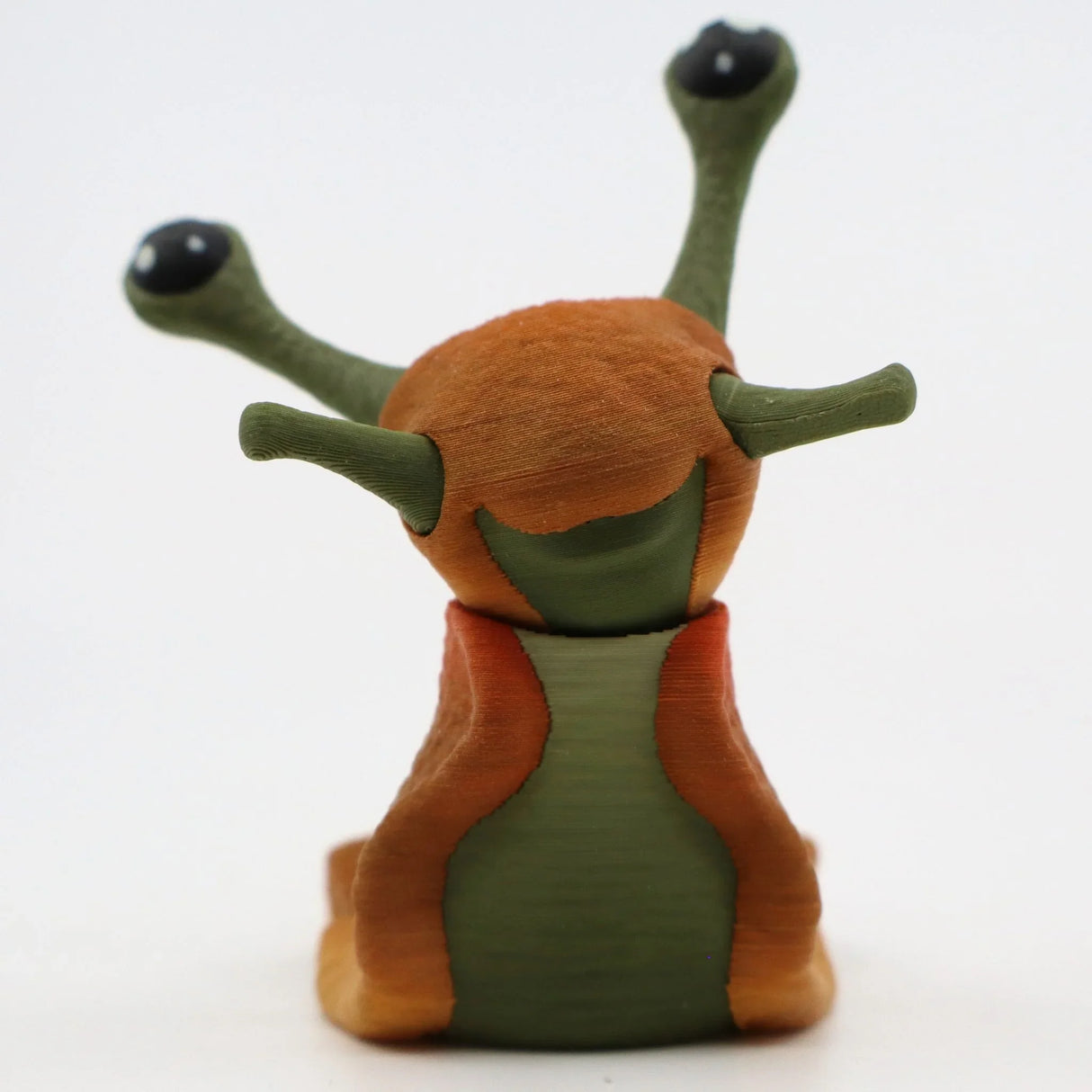 3D printed sensory slug toy with green and orange segments, shown on white background