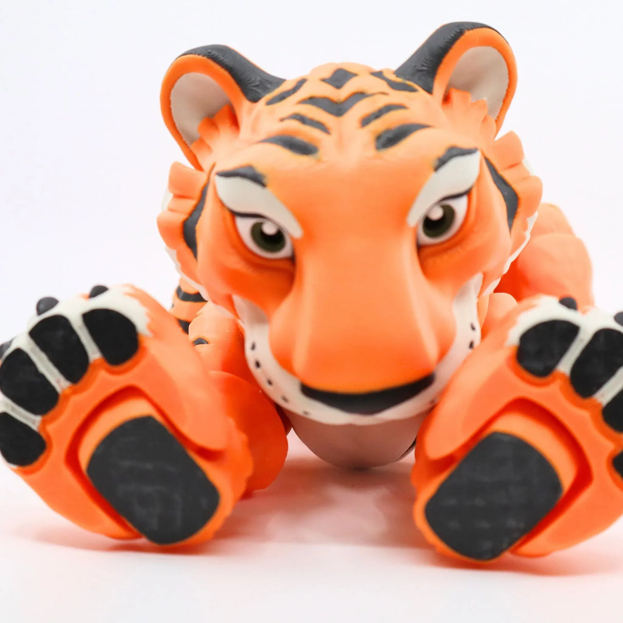 3D printed sensory tiger toy, bright orange with black stripes, on white background