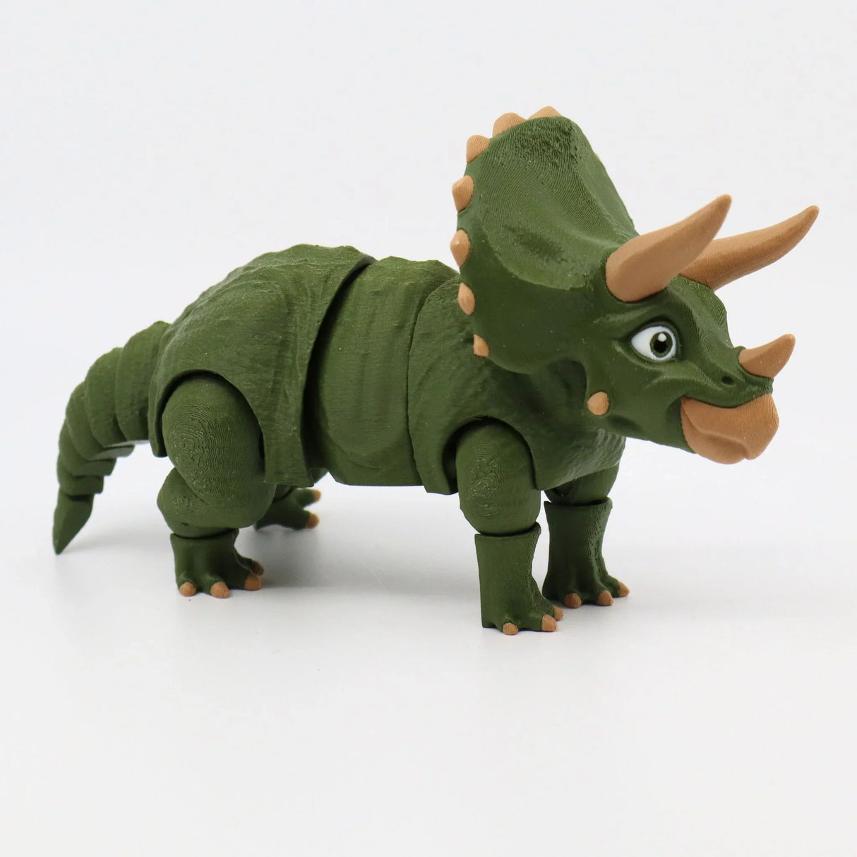 Green 3D printed triceratops sensory toy on white background, dinosaur figure for kids
