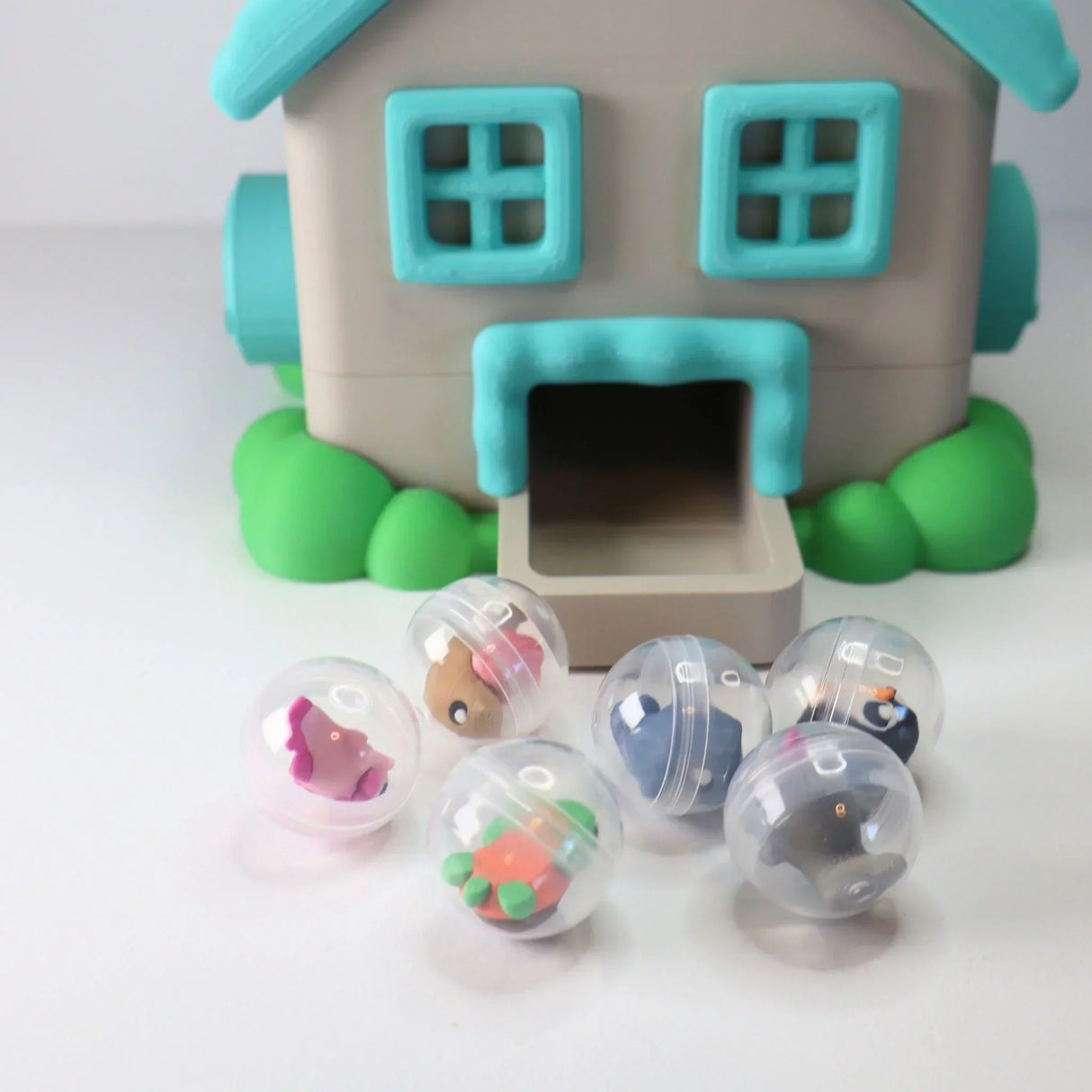 Colorful sensory toy house with six animal capsule toys for children