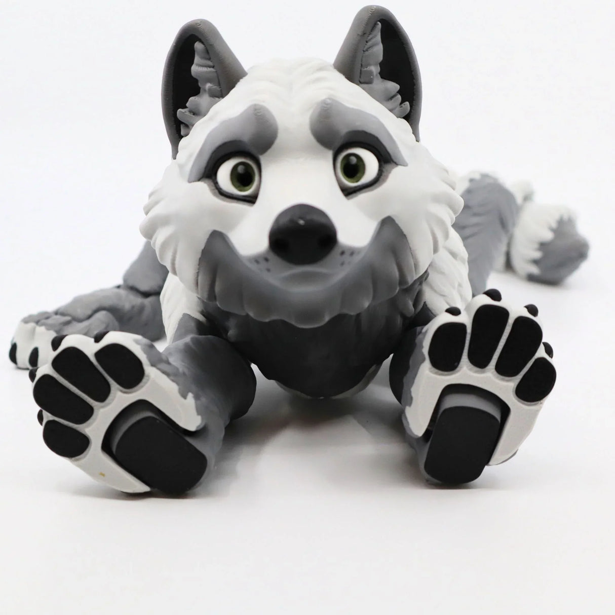 Cute gray and white 3D printed wolf sensory toy with large paws on white background