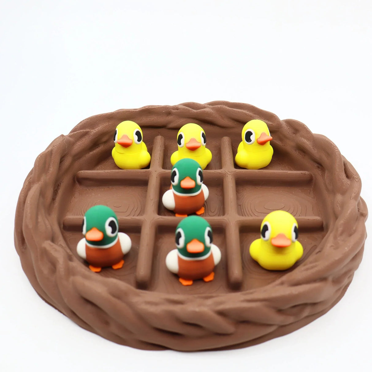 Colorful duck sensory toys in a 3D printed nest, perfect for fidgeting and sorting play