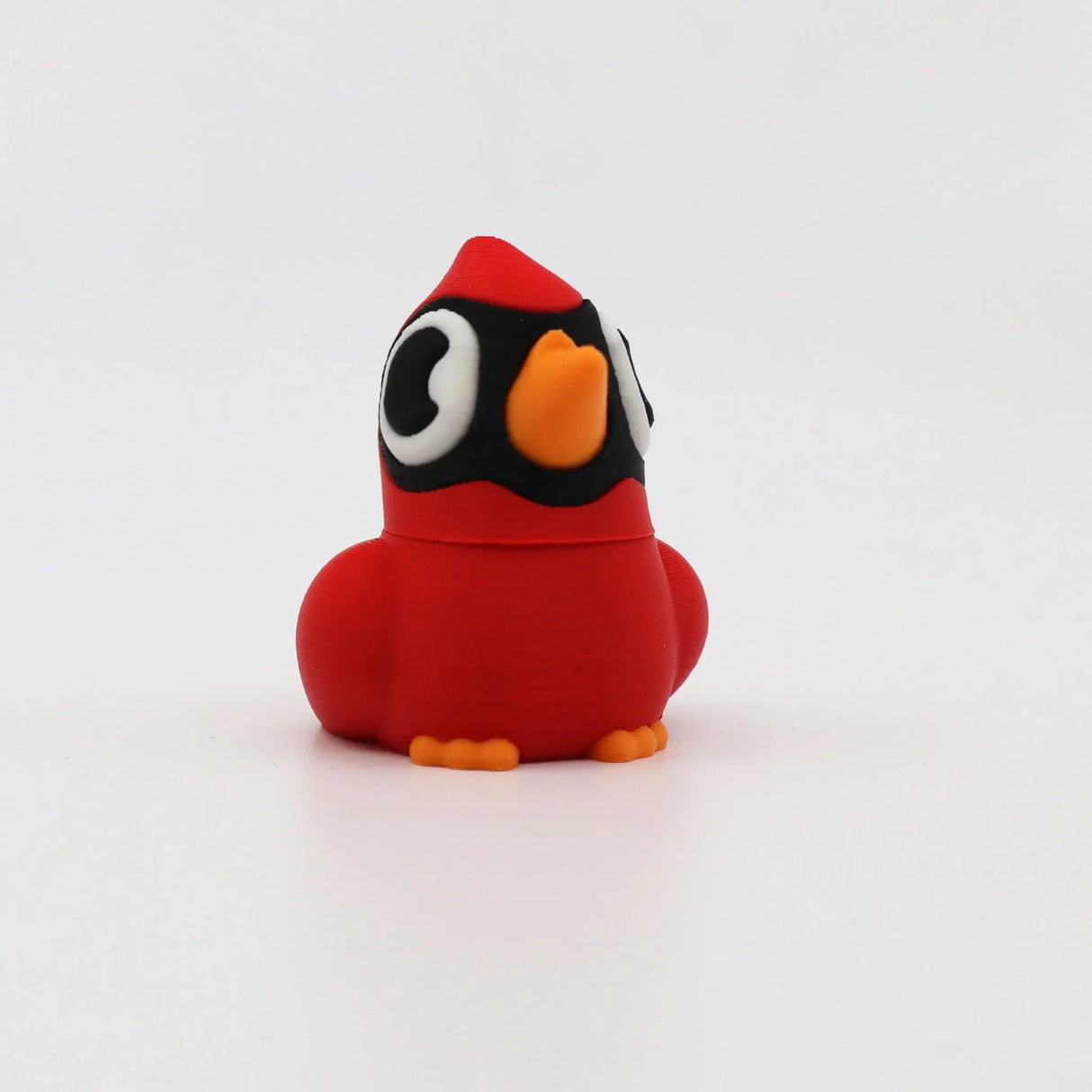 Red 3D printed cardinal fidget toy with orange beak and feet, sensory-friendly design for kids