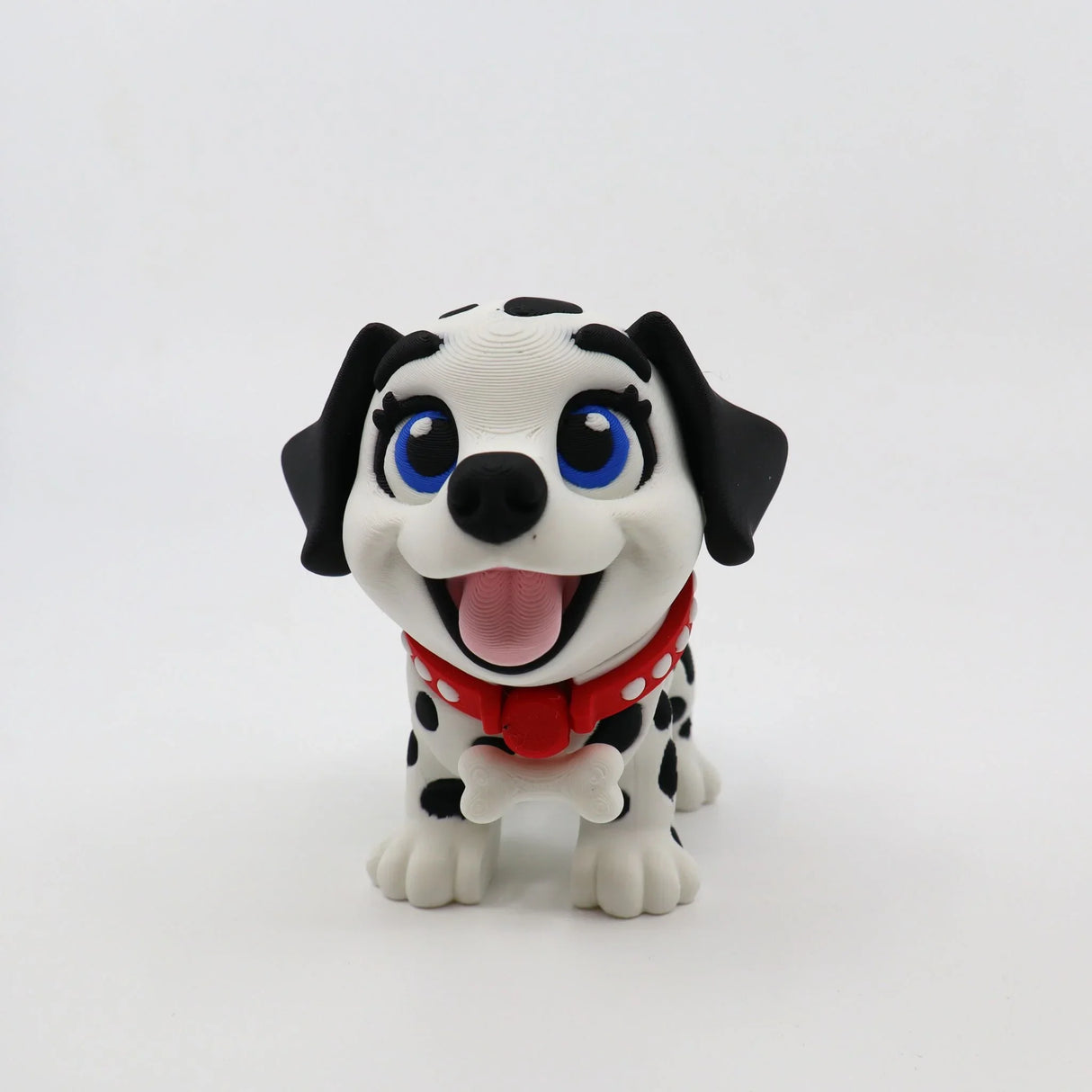3D printed Dalmatian puppy fidget toy with red collar, blue eyes, and bone accessory for sensory play