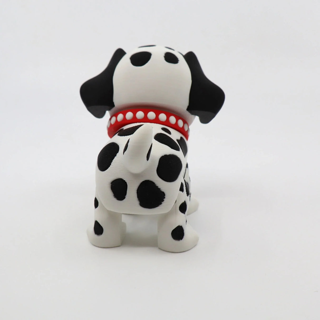 3D printed Dalmatian fidget toy with red collar, sensory-friendly design for kids