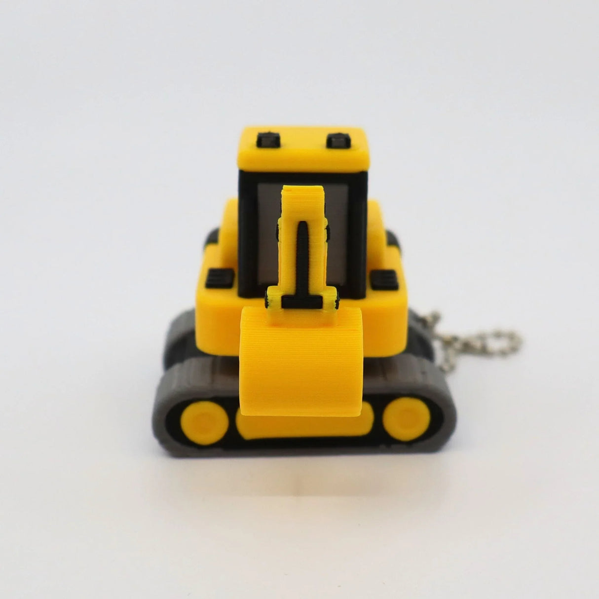 Yellow 3D printed excavator fidget toy with keychain, sensory-friendly construction vehicle for kids