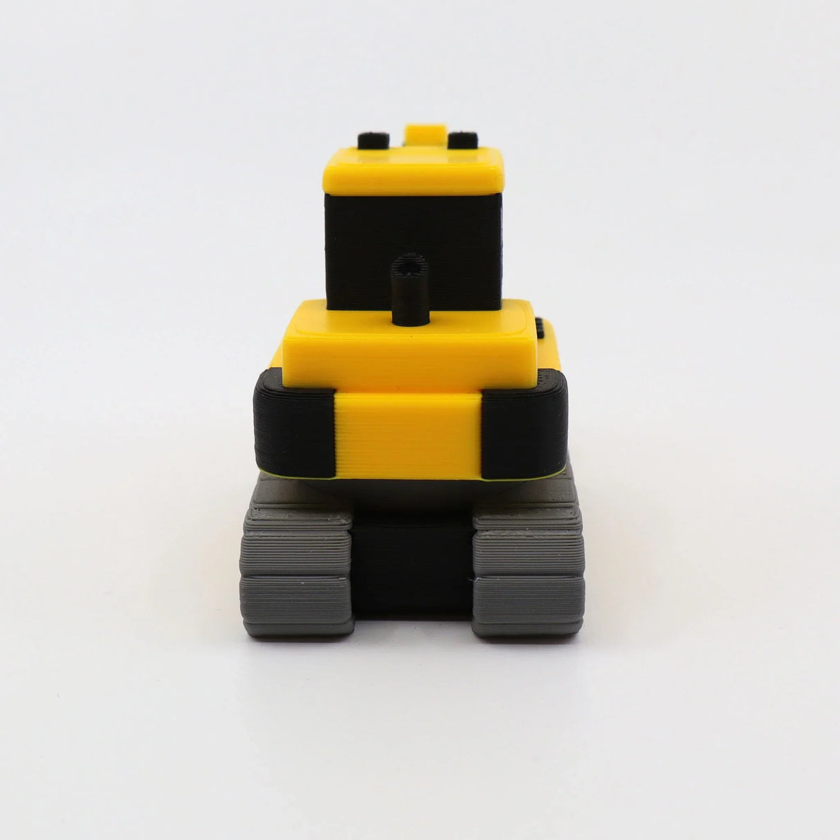 3D printed yellow and black sensory fidget toy with textured tracks for tactile play