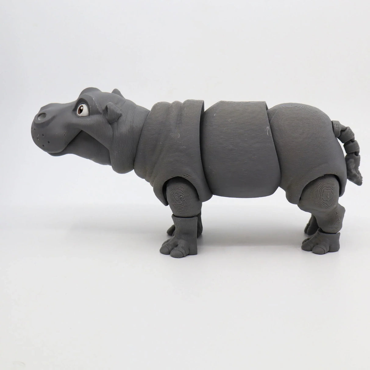 Gray 3D printed hippo sensory toy with movable joints on a white background