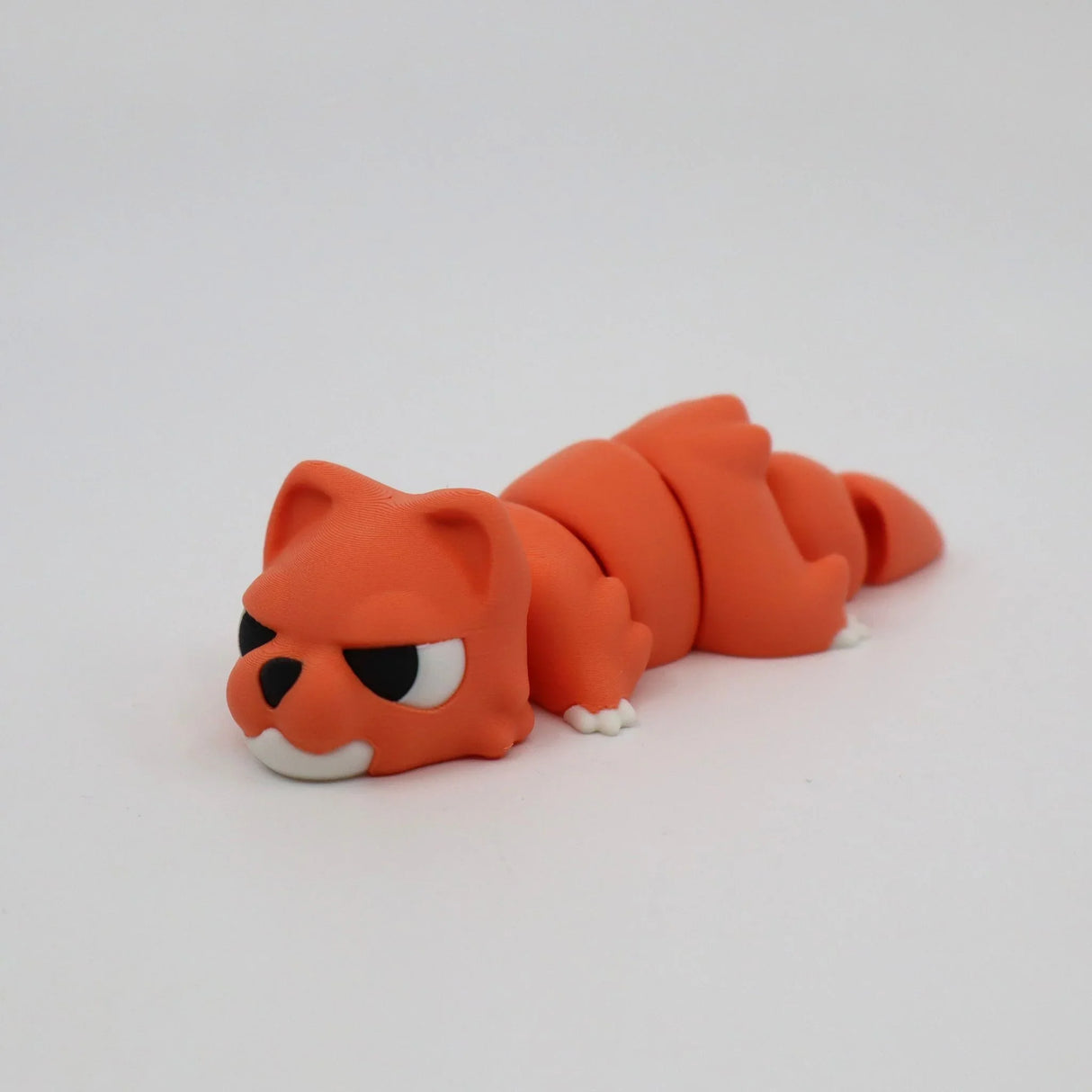 Orange 3D printed sensory fidget toy shaped like a cat, segmented body, white background