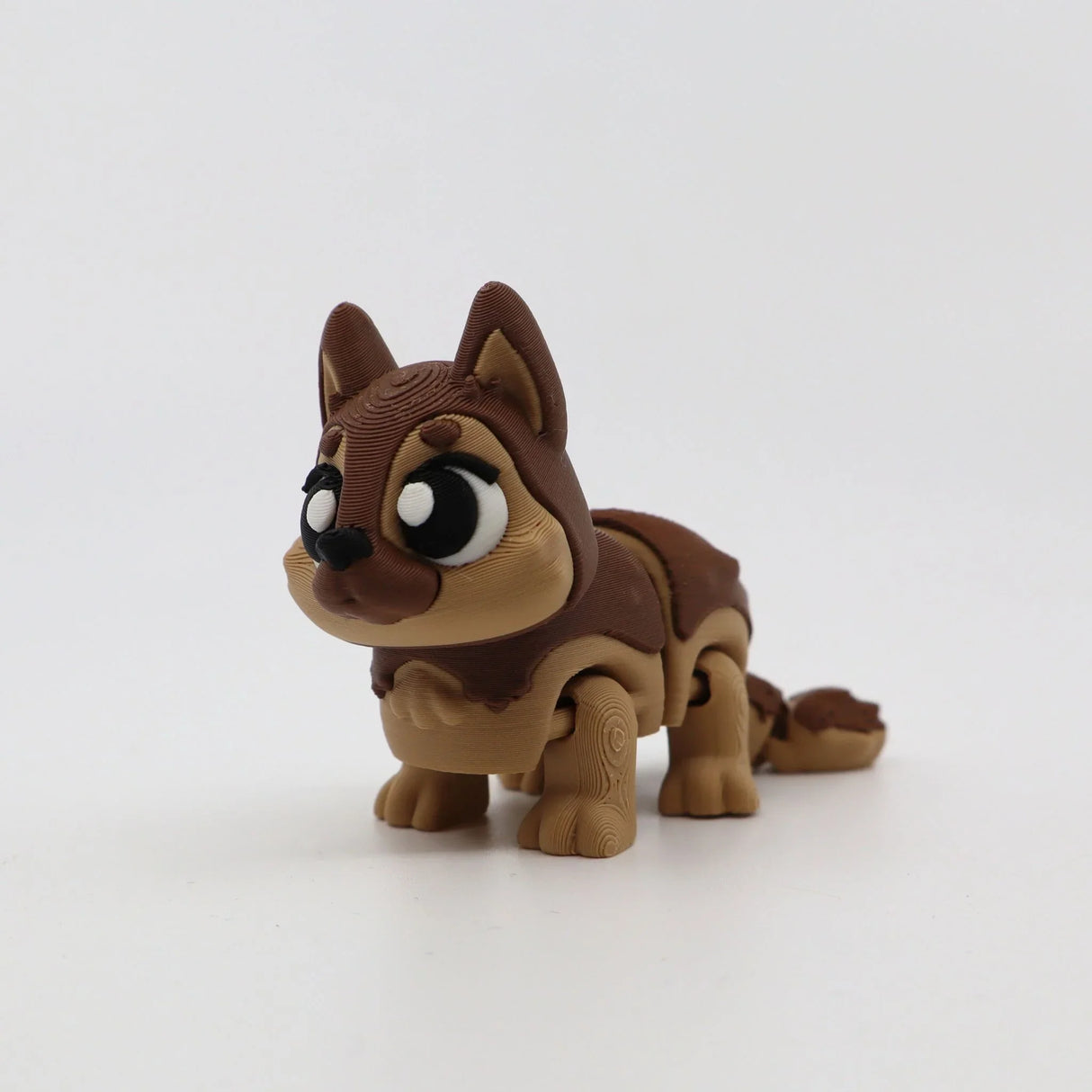 3D printed flexi dog toy for sensory play, featuring articulated joints and cute cartoon eyes