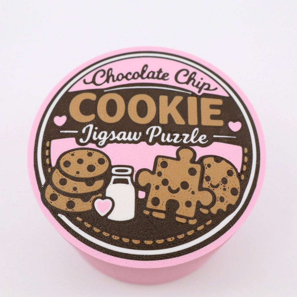 Chocolate chip cookie jigsaw puzzle container with playful cookie and milk design