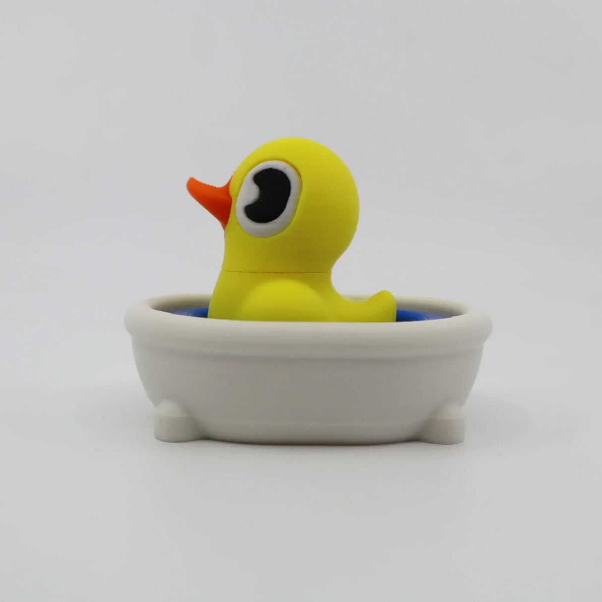 Yellow 3D printed duck fidget toy in mini bathtub, sensory toy for kids