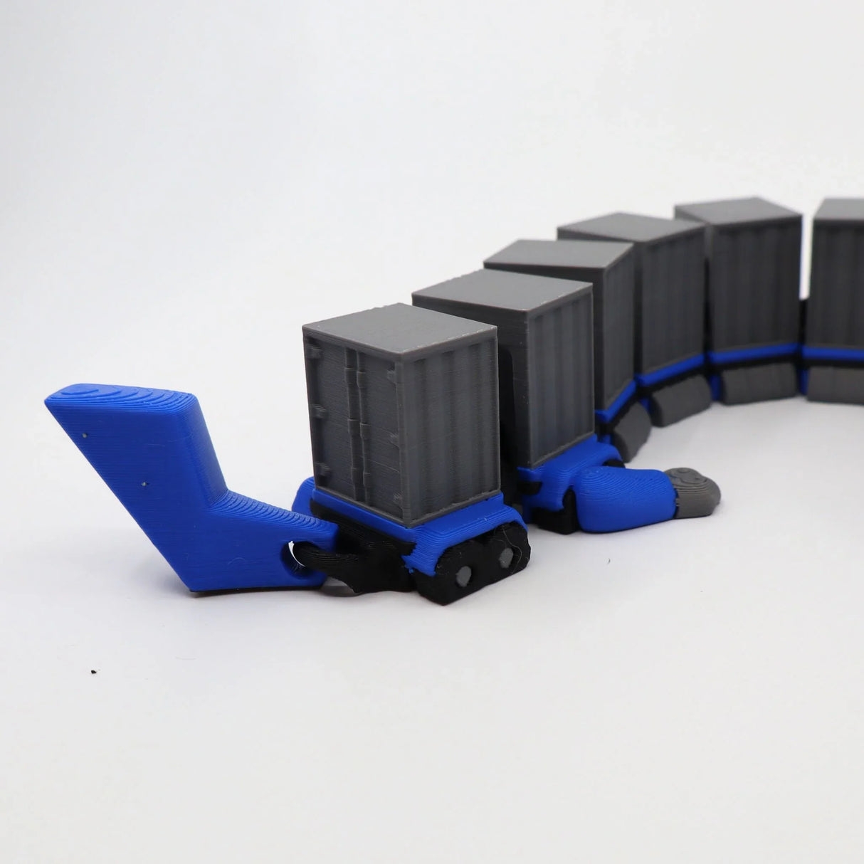 Blue and gray 3D printed fidget toy with interlocking cargo containers for sensory play
