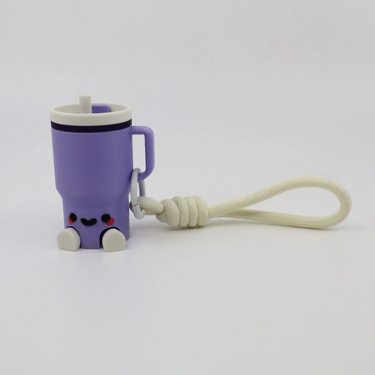 Purple 3D printed fidget toy shaped like a cup with handle, smiley face, and keychain loop for sensory play