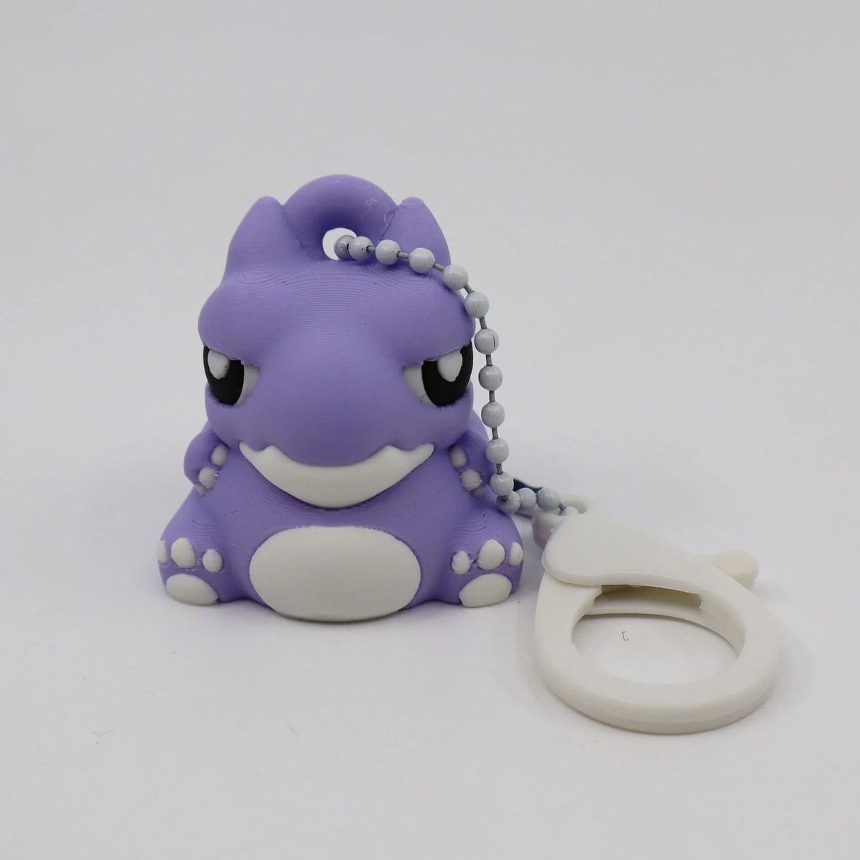 Purple 3D printed warthog sensory toy keychain with white clasp on white background