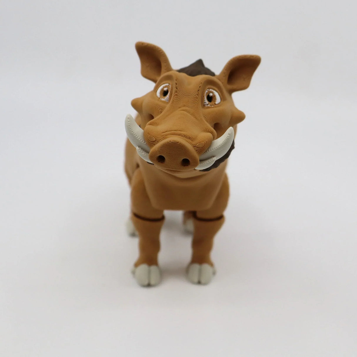 3D printed sensory toy warthog with articulated joints on white background