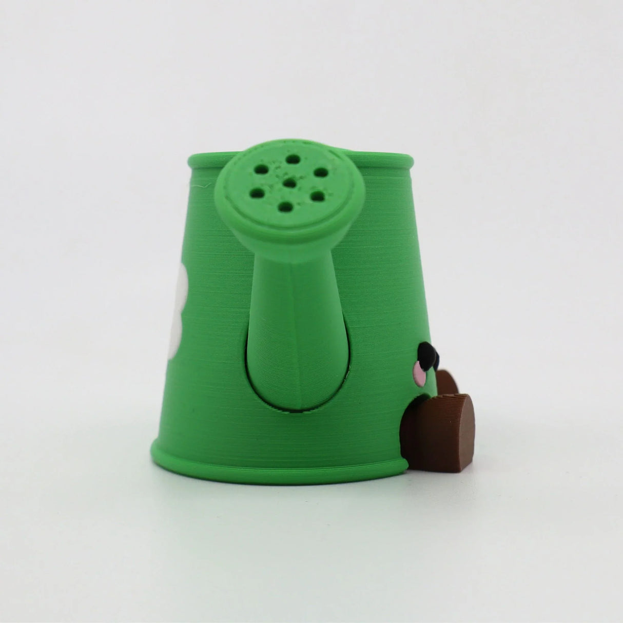 Green 3D printed watering can fidget toy with cute face for sensory play