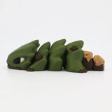 Green 3D printed sensory caterpillar toy with flexible segments on white background