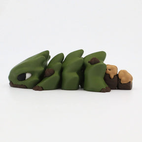 Green 3D printed sensory caterpillar toy with flexible segments on white background