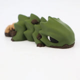 3D printed green sensory toy lizard with brown accents on white background