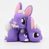 Purple 3D printed sensory bunny toy with white spikes and pink ears, cute animal design