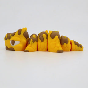 Yellow and brown segmented 3D printed sensory fidget caterpillar toy on white background
