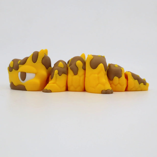 Yellow and brown segmented 3D printed sensory fidget caterpillar toy on white background