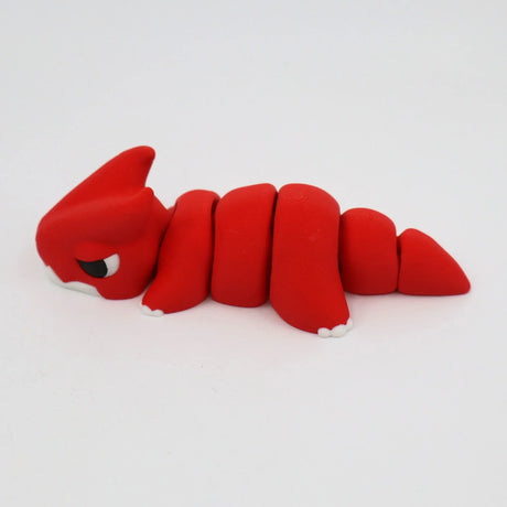 Red 3D printed flexi dinosaur sensory toy with segmented body on white background