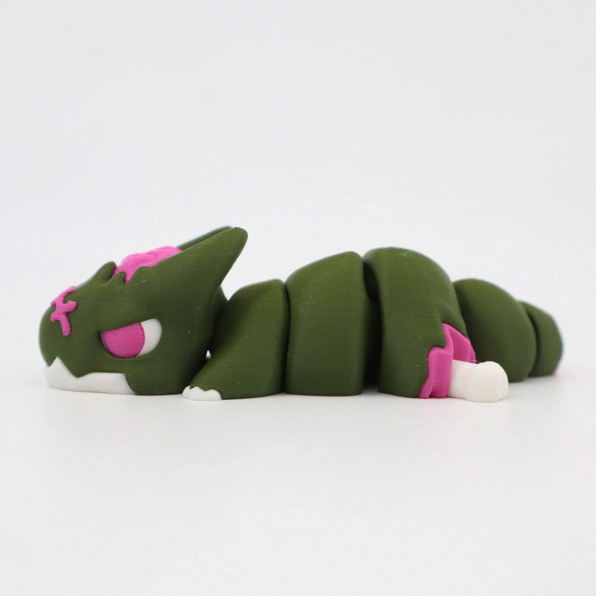 Green and pink 3D printed articulated cat sensory fidget toy on white background