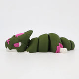 Green and pink 3D printed articulated cat sensory fidget toy on white background