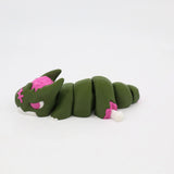 Green and pink 3D printed segmented sensory toy cat on white background