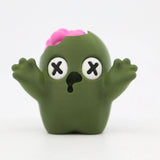 Green 3D printed zombie sensory toy with raised arms and exposed pink brain