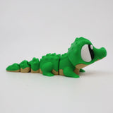 Green 3D printed alligator fidget toy with textured segments for sensory play