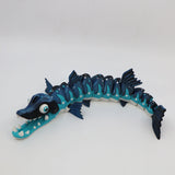 Blue 3D printed sensory toy barracuda with articulated body and white fins
