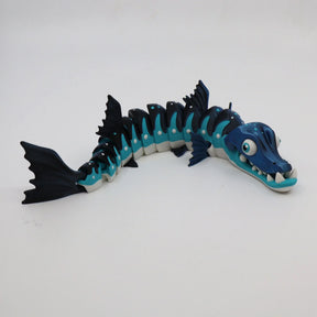Blue and black articulated barracuda sensory toy with flexible segments on white background