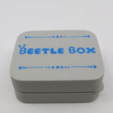 Gray plastic Beetle Box case with blue lettering, sensory toy storage container.