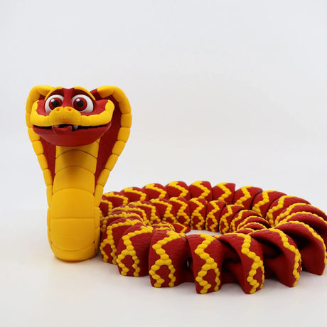 Red and yellow 3D printed cobra sensory toy with articulated body and playful expression